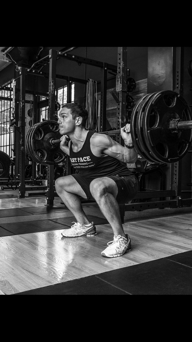 Heavy barbell squat at Fast Pace gym San Francisco